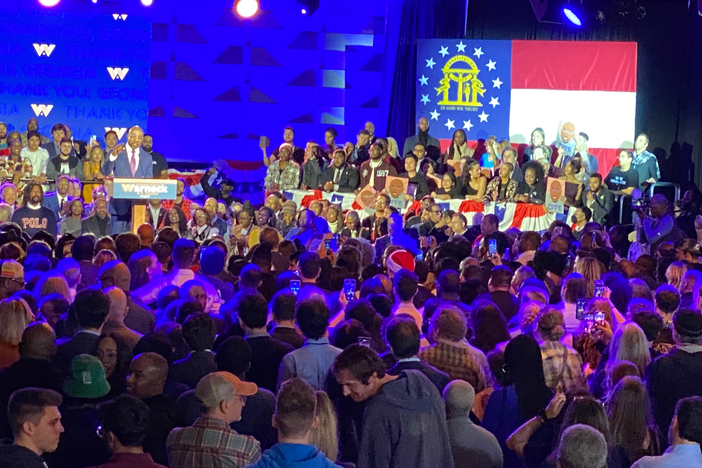 U.S. Sen. Raphael Warnock gives a victory speech after winning reelection over Republican challenger Herschel Walker in a Dec. 6, 2022, runoff campaign.