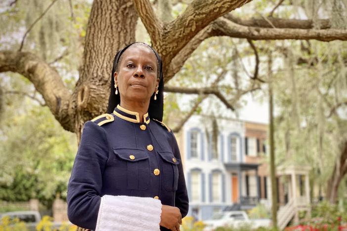 Rozz Rouse, who co-chairs the Coalition to Name Taylor Square, poses at the Savannah square formerly named Calhoun Square. She is dressed as Susie King Taylor, a nurse who served with the Union during the Civil War.