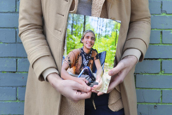 Vienna holds a photo of her slain partner, Tortuguita, in Atlanta on Thursday, Jan. 26, 2023. Officials have said officers fatally shot Tortuguita in self-defense after the protester shot a trooper on Wednesday, Jan. 18, but activists argue it was a state-sanctioned murder of a beloved community member who was renowned for having a big heart.