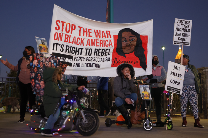 Demonstrators gather during a protest over the death of Tyre Nichols, Friday, Jan. 27, 2023, in Atlanta. (AP Photo/Alex Slitz)