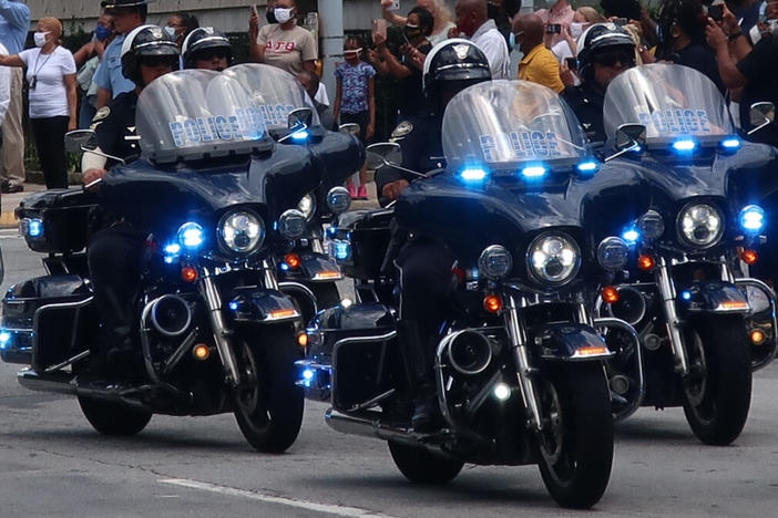 A quartet of police officers on motorcycles 