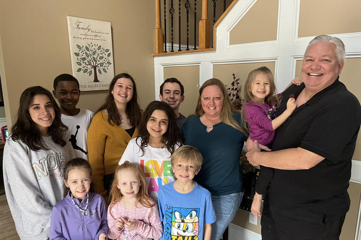 Lisa Rager knows well the hurdles to obtaining services for foster kids. She and her husband, Wes, have cared for more than 100 foster children and adopted 11 of them, many of whom are pictured. Rager says one child waited more than a year for an appointment to see a specialist doctor.