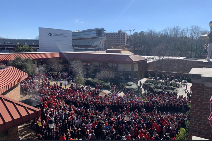 Fans stand outside Sanford Stadium in Athens on the campus of UGA as the school welcomes home the 2023 National Champion Bulldogs. Isabela Weiss/WUGA