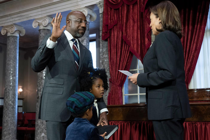 Vice President Kamala Harris participates in a ceremonial swearing-in of Sen. Raphael Warnock, D-Ga., as his children Chloe and Caleb Warnock hold the Bible, in the Old Senate Chamber on Capitol Hill in Washington, Tuesday, Jan. 3, 2023.