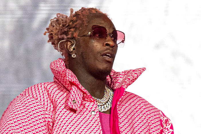 Young Thug performs at the Lollapalooza Music Festival in Chicago on Aug. 1, 2021. Jury selection has been slow going in the Atlanta racketeering and gang case against rapper Young Thug and others, with many potential jurors trying to get out of serving and alleged attempts to smuggle contraband to defendants also causing delays. 
