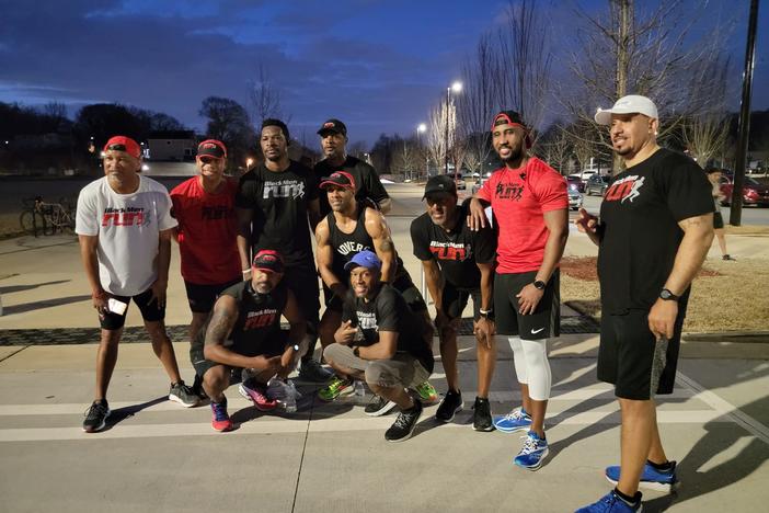 Members of Atlanta's Black Men Run pose for a photo after an event to honor Ahmaud Arbery in 2022.