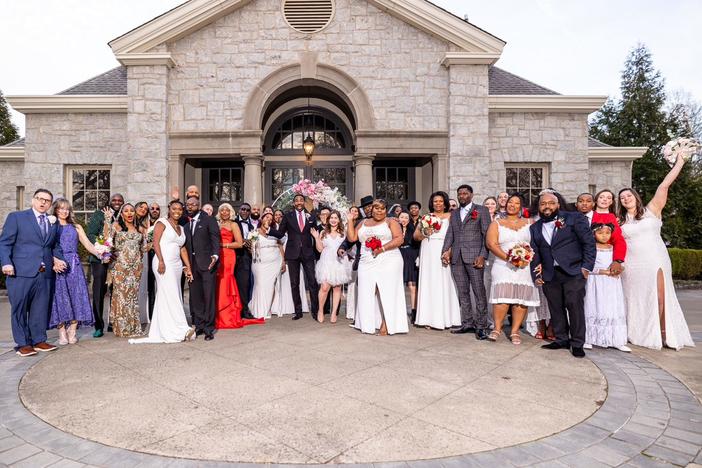 Mayor Andre Dickens officiated a mass wedding at Atlanta's Piedmont Park on Valentine's Day 2023.