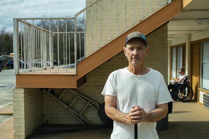 Bill Fuson moved from the now-demolished Magnolia Court to the hotel last April. Desire lines mark the path he walks regularly to the Piggly Wiggly on the other side of Interstate 75. 