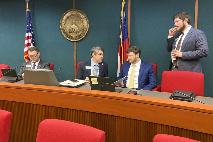 Georgia House Ways and Means Committee Chairman Shaw Blackmon, R-Bonaire, center left, talks to a staffer on Thursday, Feb. 16, 2023, at the Capitol in Atlanta. The committee passed bills to give taxpayers another $1 billion in income tax breaks and to ratify Gov. Brian Kemp's fuel tax suspension. 