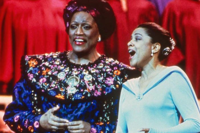 Jessye Norman and Kathleen Battle singing on stage.