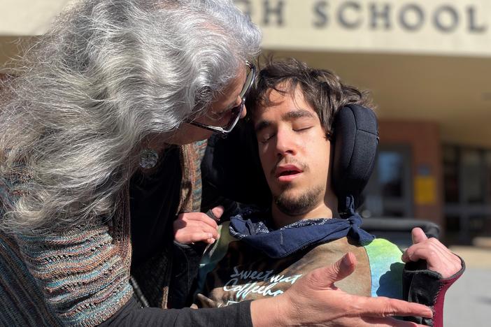 Jane Grillo and Joe Grillo outside White County High School