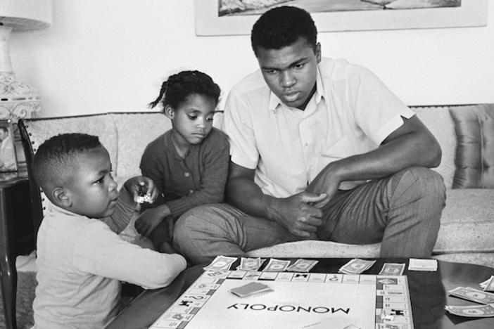 Muhammad Ali and his children play Monopoly.