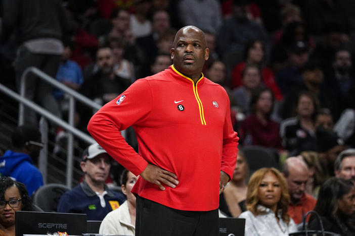 Atlanta Hawks head coach Nate McMillan looks on from the bench during the first half of an NBA basketball game against the Phoenix Suns, Thursday, Feb. 9, 2023, in Atlanta.