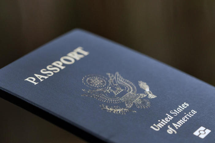 The cover of a U.S. Passport is displayed in Tigard, Ore., Saturday, Dec. 11, 2021.