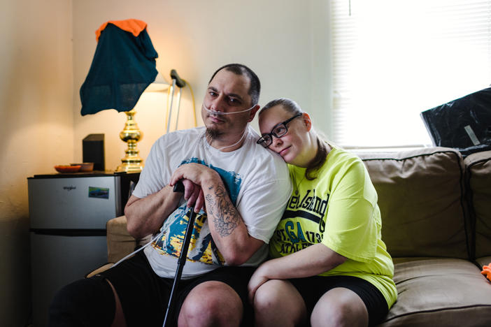 Matthew Boyd sits with his fiancée, Amanda Hollowood, who has helped care for him since he was released from prison in December 2020.