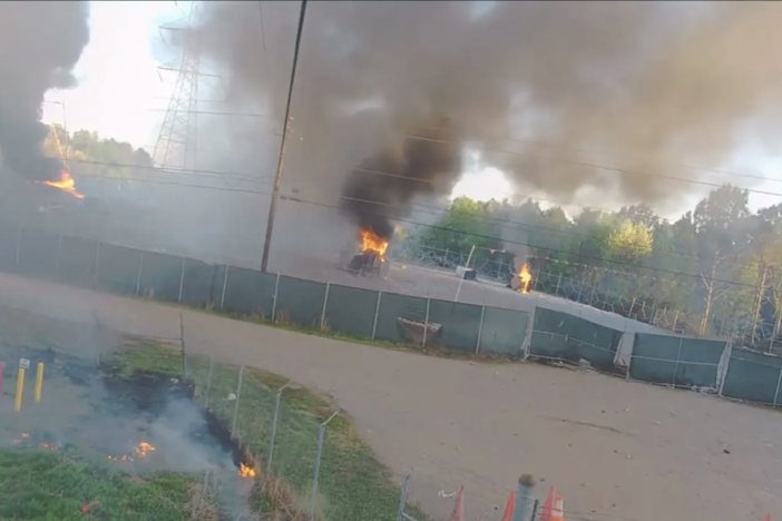 Surveillance video released by APD shows multiple pieces of construction equipment on fire at the Atlanta public safety training facility.