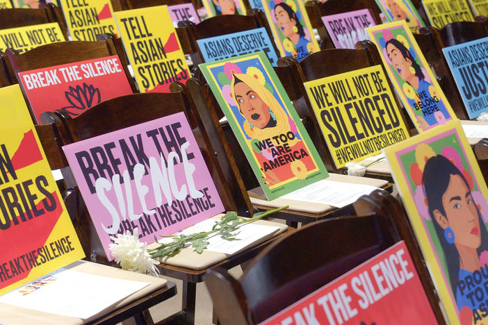 Protest signage with empty chairs in remembrance