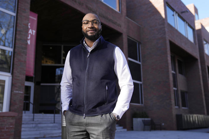 Quentin Fulks, who managed Sen. Raphael Warnock's re-election campaign in 2022, stands for a portrait outside the John F. Kennedy School of Government at Harvard University, Thursday, Feb. 2, 2023, in Cambridge, Mass. Growing up Black in a majority white county where Donald Trump won 79% of the vote helped Fulks understand what Democrats had to do to win in a historically conservative state.