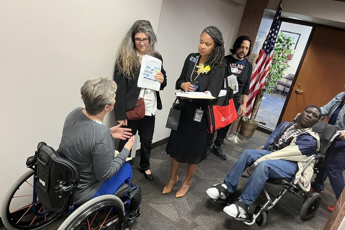  Wendy Dean (left) with the Georgia Advocacy Office talks to state Sen. Nikki Merritt in the hallway of the Coverdell Legislative Office Building on Wednesday’s day of advocacy. Jill Nolin/Georgia Recorder