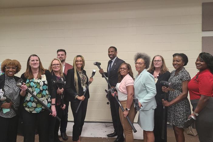 Atlanta Mayor Andre Dickens joins representative from Grady Memorial Hospital in breaking down the first wall for the new  Center for Diversion and Services on March 31, 2023.