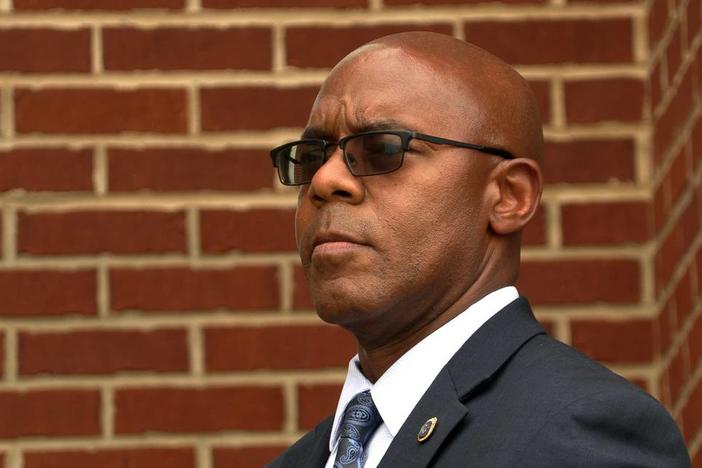 Columbus Police Chief Freddie Blackmon listens to a speaker during a Tuesday evening rally outside the City Services Center prior to Tuesday night’s Columbus Council meeting. 