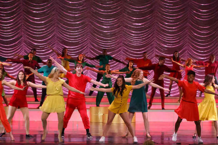 High schoolers performing in a musical.