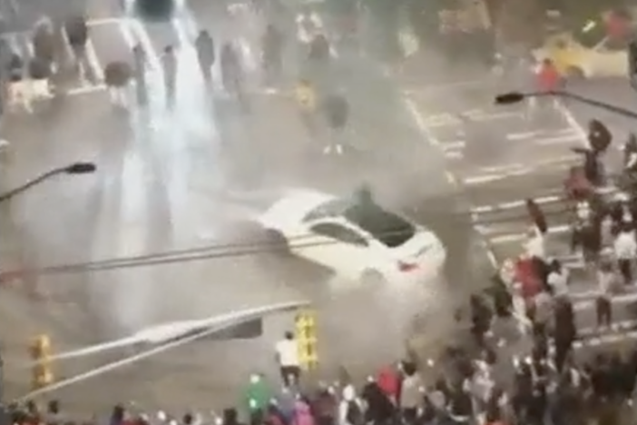 Crowds gather Downtown to watch cars laying drag and street racing over the weekend. 
