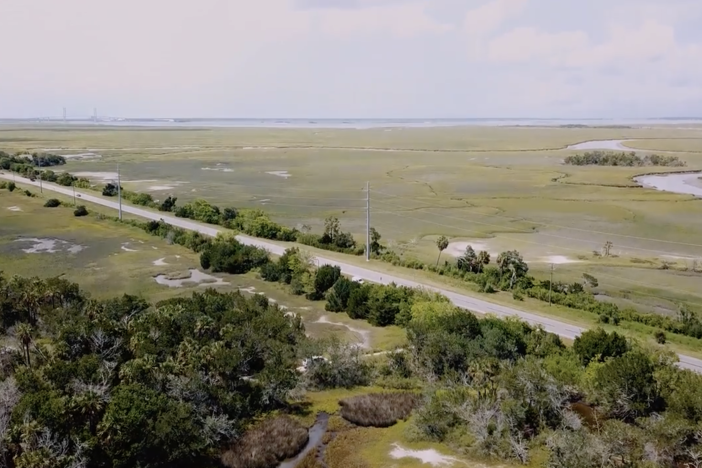 Road to Jekyll Island with surrounding green space and swamp lands