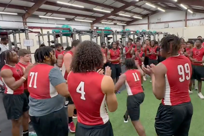 The Warner Robins football team brings the energy in warmups for new head coach Shane Sams.