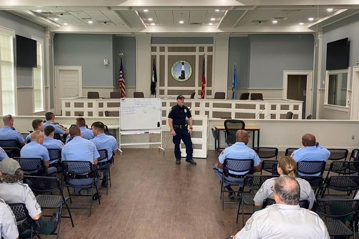 Tybee Island Police Lieutenant Emory Randolph briefs law enforcement officers from various state agencies on April 28, 2023, at the city's Burke Day Public Safety Building.