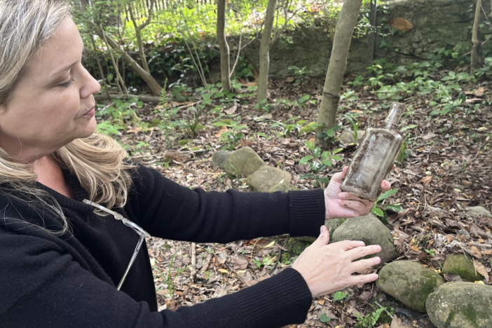 Many objects, like this bottle, have been unearthed in Elizabeth Burns’ lead-contaminated Atlanta yard. 