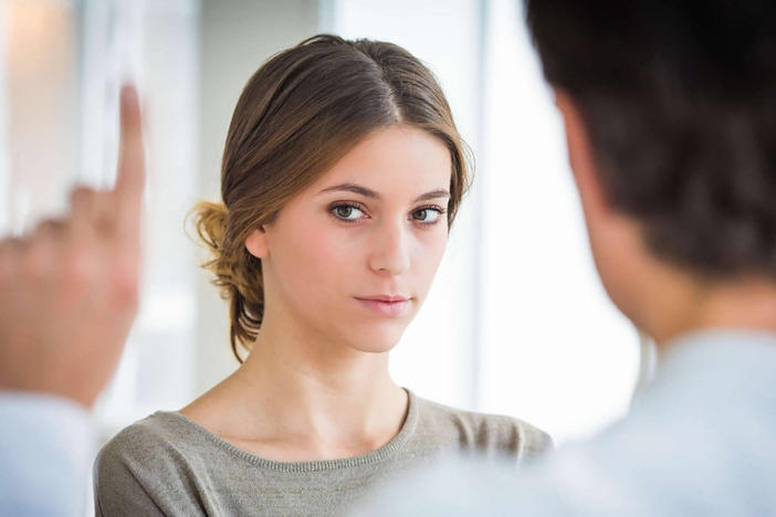 A woman follows a therapist's finger during EMDR treatment