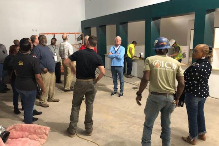 Macon-Bibb Board of Elections members and staff take a look at the new office inside the lower level of the old Sears at Macon Mall.