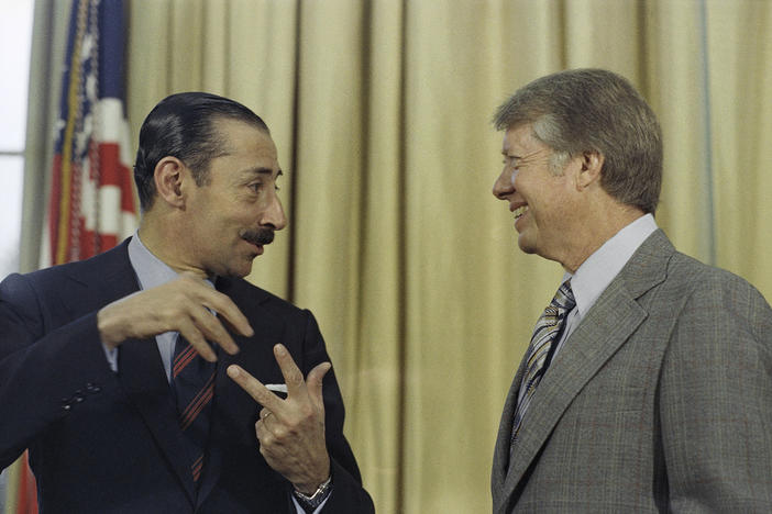 FILE - President Jimmy Carter with Jorge R. Videla, President of Argentina, at a meeting at the White House in Washington on Sept. 9, 1977.