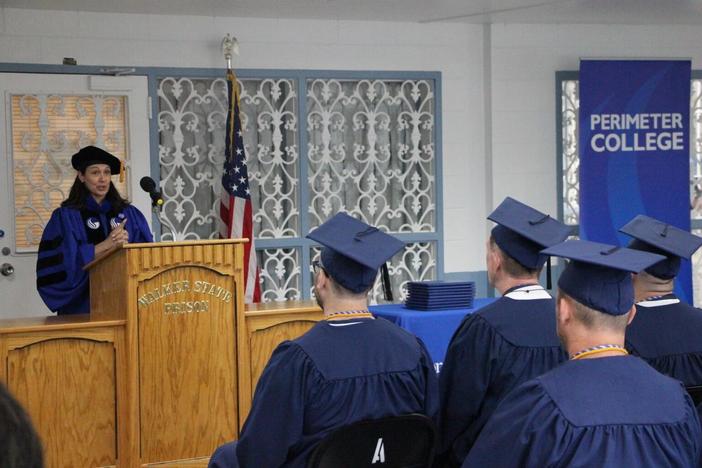 Dr. Lauri Goodling, Associate Dean for GSU’s Perimeter College Honors College speaks to graduating class at Walker State Prison. All students received an associate degree in general studies with honors distinction. 