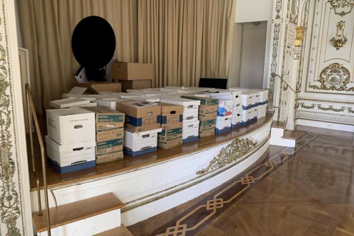 This image, contained in the indictment against former President Donald Trump, shows boxes of records being stored on the stage in the White and Gold Ballroom at Trump's Mar-a-Lago estate in Palm Beach, Fla. Trump is facing 37 felony charges related to the mishandling of classified documents according to an indictment unsealed Friday, June 9, 2023. (Justice Department via AP)