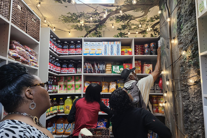 Fulton County families make the first bags after the County Clerk office held a ribbon cutting for their new food pantry June 12, 2023.