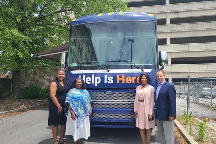 Fulton County Behavioral Health Director LaTrina Foster, far left, along with Fulton County Manager Dick Anderson, far right, attend the first stop of the Mobile Mental Health Unit on June 2, 2023. 