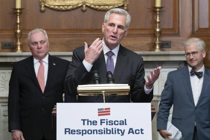 House Speaker Kevin McCarthy of R-Calif., speaks as House Minority Whip Rep. Steve Scalise, R.La., left, and Rep. Patrick McHenry, R-N.C., listen at a news conference after the House passed the debt ceiling bill at the Capitol in Washington, Wednesday, May 31, 2023. The bill now goes to the Senate. (AP Photo/Jose Luis Magana)