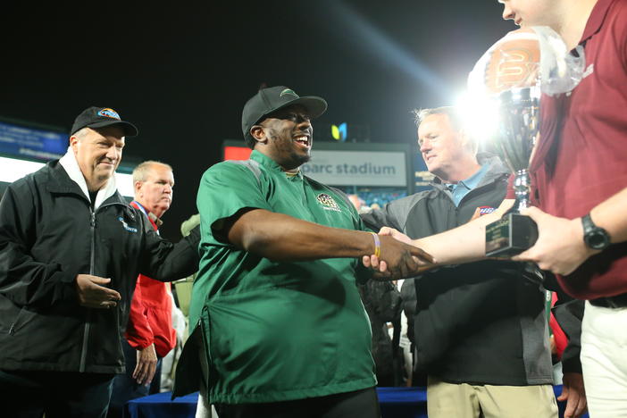 Hughes head Coach Boone Williams (right) and GPB reporter Jon Nelson after the Panthers won the 2022 GHSA 6A State Championship at Center Parc Stadium.