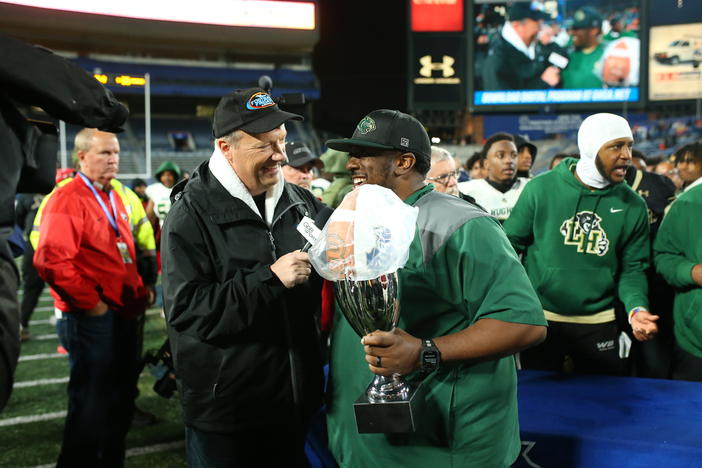 Langston Hughes Head Coach Daniel "Boone" Williams talks with GPB's Jon Nelson after his 6A State Championship win..