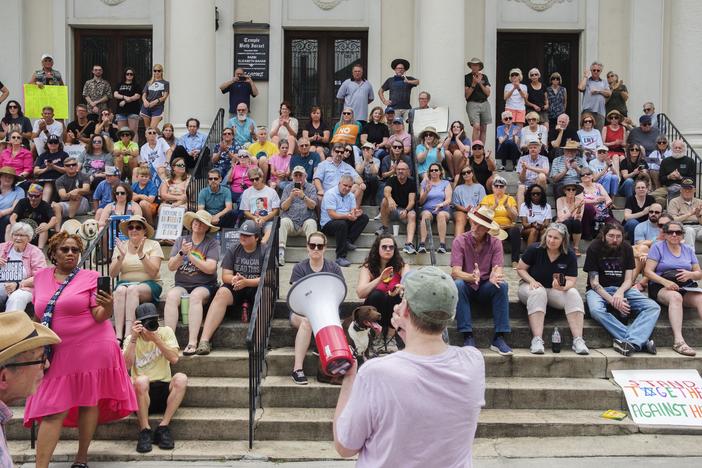 Macon residents gathered on the steps of Temple Beth Israel in support of the Jewish community Saturday a day after a hate group targeted the 164-year-old congregation.