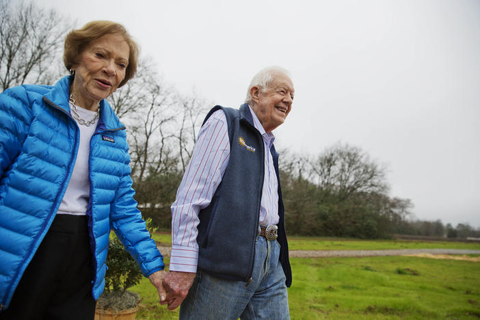 In this Feb. 8, 2017, photo, former President Jimmy Carter, right, and his wife Rosalynn arrive for a ribbon cutting ceremony for a solar panel project on farmland he owns in their hometown of Plains, Ga. Jimmy and Rosalynn are celebrating their 77th wedding anniversary, Friday, July 7, 2023. 