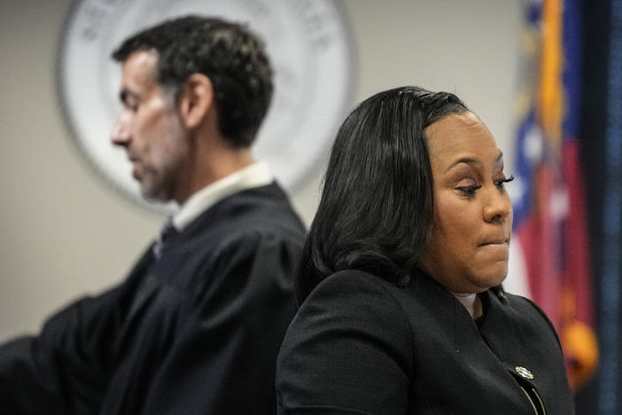 Fulton County District Attorney Fani Willis, right, and Fulton County Superior Court Judge Robert McBurney speak in the Fulton county courthouse, Tuesday, July 11, 2023, in Atlanta. A grand jury being seated Tuesday in Atlanta will likely consider whether criminal charges are appropriate for former President Donald Trump or his Republican allies for their efforts to overturn his 2020 election loss in Georgia. 