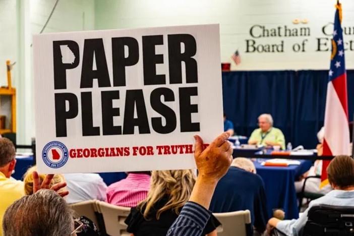 Activists attending a meeting of the Chatham County Election Board call for replacing voting machines with paper ballots, Monday, July 10, 2023. (Craig Nelson)