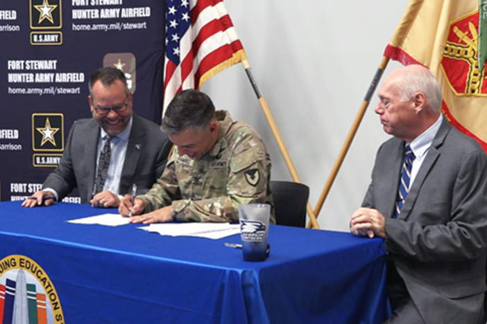 Fort Stewart-Hunter Army Airfield Garrison Commander Col. Manuel Ramirez signs an agreement with Georgia Southern University officials at Fort Stewart near Hinesville on July 31, 2023.