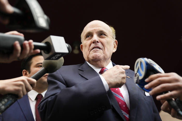 Former Mayor of New York Rudy Giuliani speaks to reporters as he leaves his apartment building in New York, Wednesday, Aug. 23, 2023.