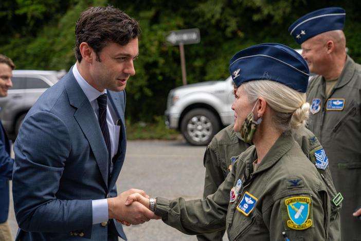 Sen. Ossoff pictured with a service member.