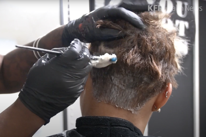 A beautician applies a relaxer on a client’s hair at a salon in Atlanta. Social and economic pressures have long compelled Black girls and women to straighten their hair. But mounting evidence suggests chemical hair straighteners could be a health hazard.