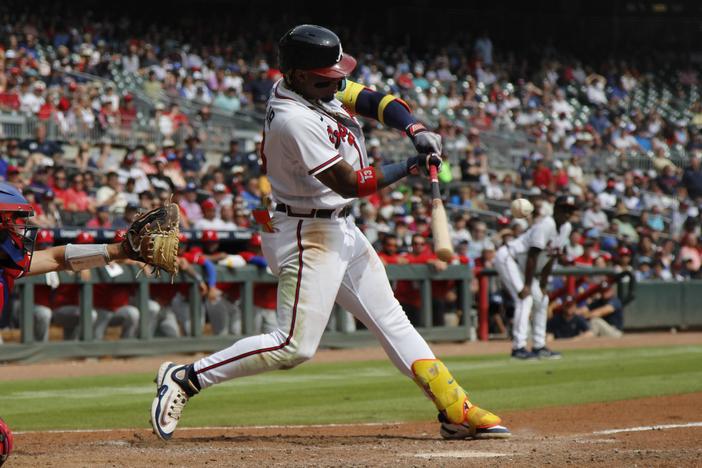 Ronald Acuña, Jr. makes contact during a game against the Philadelphia Phillies at Truist Park, September 20, 2023. 